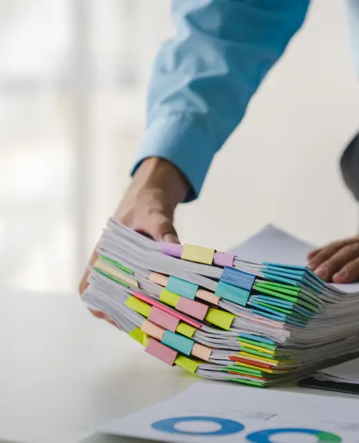 businessman-working-on-stacks-of-documents-to-sear-2025-03-08-09-55-30-utc businessman-working-on-stacks-of-documents-to-sear-2025-03-08-09-55-30-utc